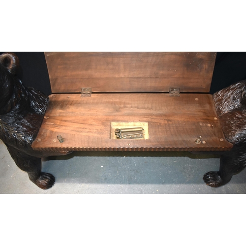 125E - A RARE LARGE 19TH CENTURY BAVARIAN BLACK FOREST CARVED WOOD MUSICAL HALL BENCH formed with two whims... 