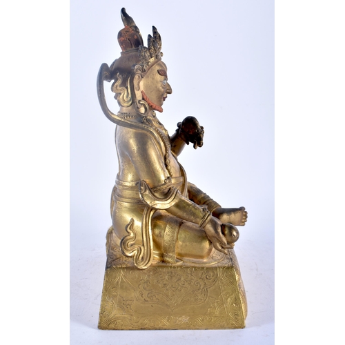 25C - A FINE CHINESE TIBETAN QING DYNASTY GILT BRONZE FIGURE OF A SEATED BUDDHA modelled holding a rat and... 