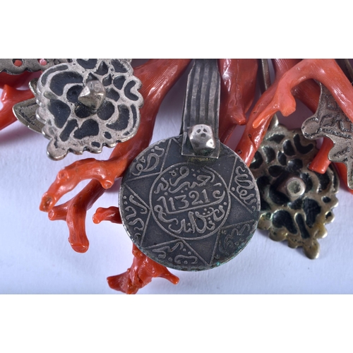 35C - AN UNUSUAL 19TH CENTURY MIDDLE EASTERN ISLAMIC STICK CORAL NECKLACE set with a central Islamic coin.... 