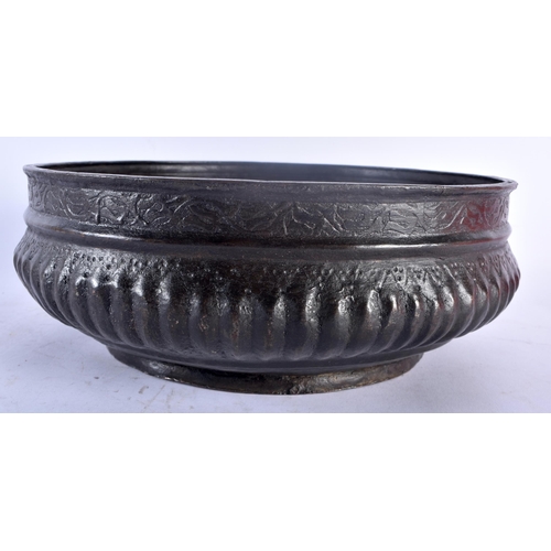 35D - AN EARLY 18TH CENTURY CONTINENTAL BRONZE ISLAMIC STYLE BASIN C1728 of circular form, the base with r... 