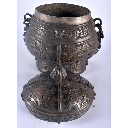 75A - A LARGE LATE 19TH CENTURY CHINESE BRONZE ARCHAIC VESSEL AND COVER Late Qing, modelled with taotie ma... 