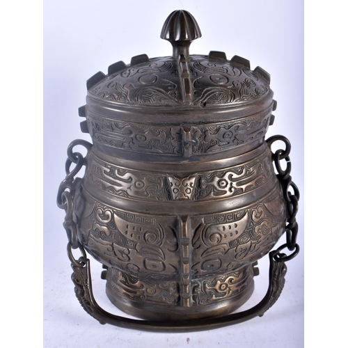 75A - A LARGE LATE 19TH CENTURY CHINESE BRONZE ARCHAIC VESSEL AND COVER Late Qing, modelled with taotie ma... 