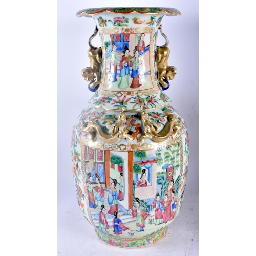 75B - A LARGE PAIR OF 19TH CENTURY CHINESE CANTON FAMILLE ROSE PORCELAIN VASES Qing, painted with figures ... 