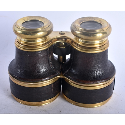 95D - A PAIR OF ANTIQUE MANCHESTER SOUTHPORT HILL BINOCULARS with leather banding. 11 cm x 10 cm.