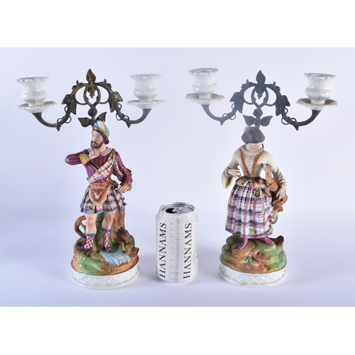 101 - A PAIR OF 19TH CENTURY FRENCH PARIS BISQUE PORCELAIN CANDLESTICKS together with a large 19th century... 