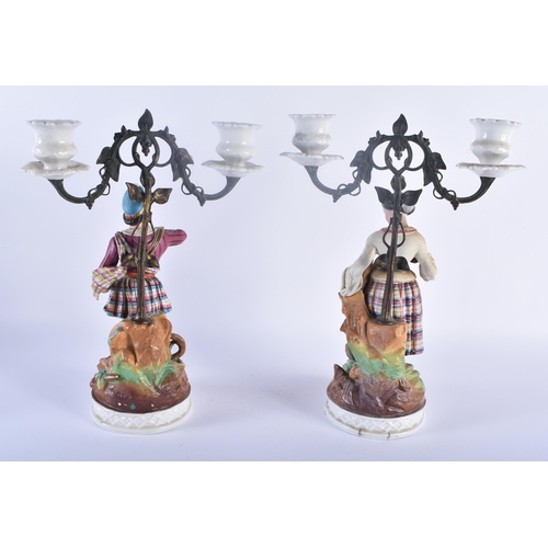 101 - A PAIR OF 19TH CENTURY FRENCH PARIS BISQUE PORCELAIN CANDLESTICKS together with a large 19th century... 