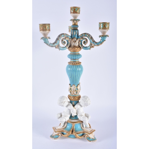 109 - A LARGE 19TH CENTURY ENGLISH SEVRES STYLE PORCELAIN BLUE GLAZED CANDELABRA formed with three cherubs... 