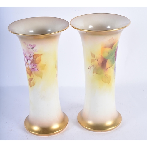 115 - A PAIR OF ROYAL WORCESTER BLUSH IVORY VASES by Kitty Blake. 19 cm high.