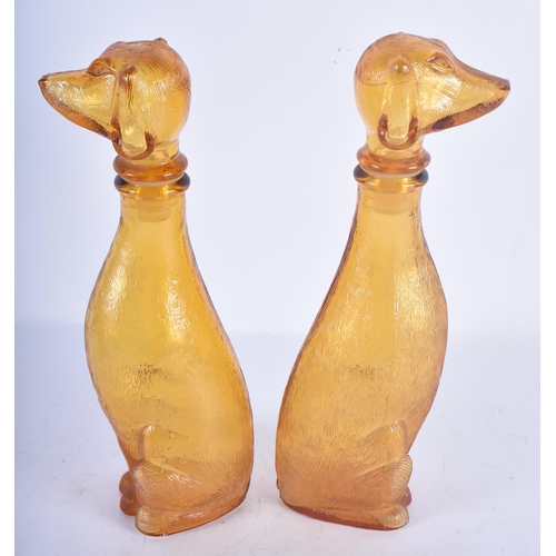 116 - A PAIR OF ART DECO SMOKEY AMBER GLASS DOG DECANTERS AND STOPPERS. 23 cm high.