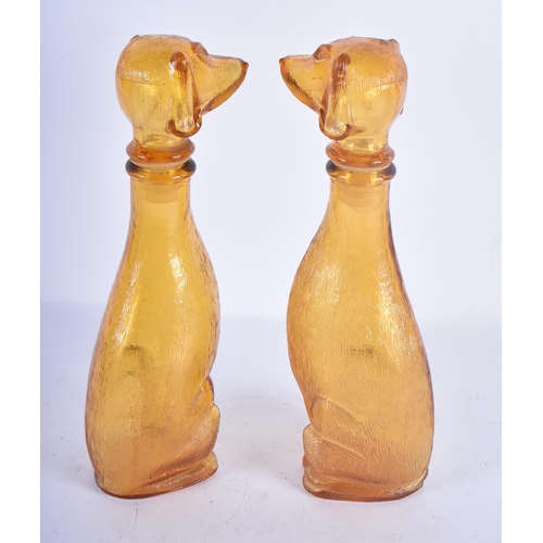 116 - A PAIR OF ART DECO SMOKEY AMBER GLASS DOG DECANTERS AND STOPPERS. 23 cm high.