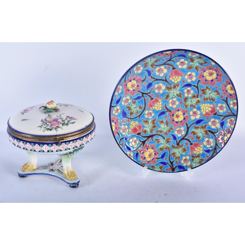 125 - A FRENCH LONGWY POTTERY ENAMELLED CIRCULAR DISH together with a tin glazed faience box. Largest 21 c... 