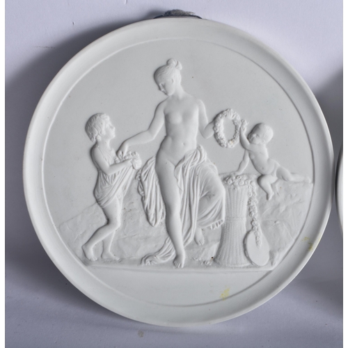 127 - THREE DANISH ROYAL COPENHAGEN PARIAN PORCELAIN BISQUE PANELS. 13 cm diameter. (3)