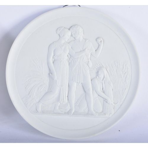 127 - THREE DANISH ROYAL COPENHAGEN PARIAN PORCELAIN BISQUE PANELS. 13 cm diameter. (3)