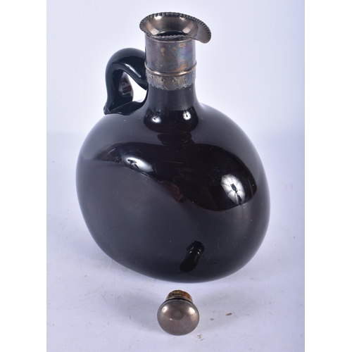 128 - AN ANTIQUE SILVER PLATED AND DARK GLASS JUG. 17 cm x 12 cm.