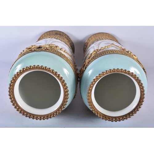 133 - A PAIR OF LATE 19TH CENTURY FRENCH SEVRES STYLE PARIS PORCELAIN VASES overlaid with gilt metal swags... 