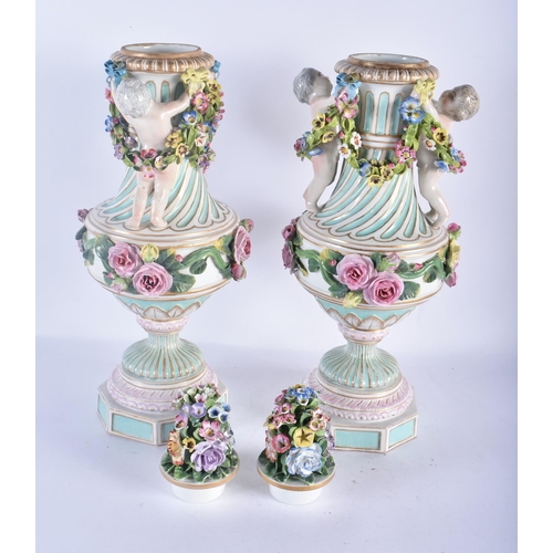 138 - A LARGE PAIR OF 19TH CENTURY GERMAN PORCELAIN TWIN HANDLED VASES AND COVERS modelled as putti holdin... 