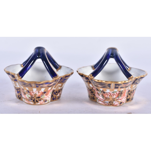 139 - A PAIR OF MINIATURE ROYAL CROWN DERBY IMARI BASKETS. 7 cm wide.