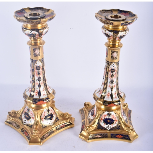 143 - A LARGE PAIR OF ROYAL CROWN DERBY IMARI CANDLESTICKS. 27 cm high.