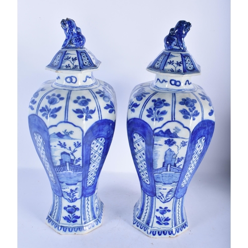 147 - A LARGE PAIR OF 18TH CENTURY DUTCH DELFT BLUE AND WHITE VASES painted with birds in landscapes. 38 c... 