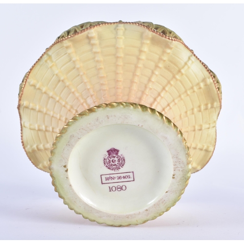 195 - Royal Worcester blush ivory basket, with over handle, pierced wavy rim, spreading cylindrical base, ... 