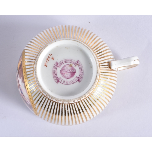 211 - Minton teacup and saucer painted with a naked baby laying on a straw mattress, globe mark, made for ... 