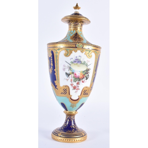 217 - Royal Crown Derby vase and cover painted with musical instruments and flowers on a turquoise and blu... 