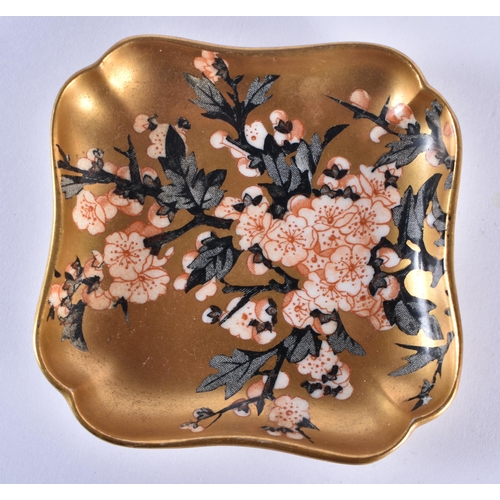 223 - Coalport set of small shaped trays with gold ground painted in Japanese style with prunus blossom.  ... 