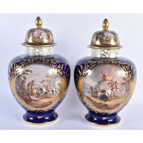 293 - A LARGE PAIR OF 19TH CENTURY GERMAN DRESDEN PORCELAIN VASES AND COVERS painted with fighting scenes.... 