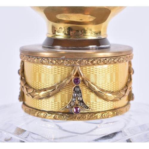 294 - A CONTINENTAL SILVER GILT AND DIAMOND CUT GLASS DECANTER. 22 cm high.