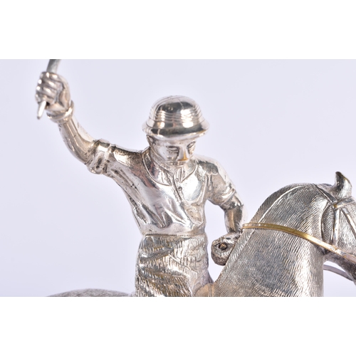 299 - AN ANTIQUE SILVER PLATED AND PINE POLO PLAYER FIGURE. 794 grams. 19 cm x 10 cm.