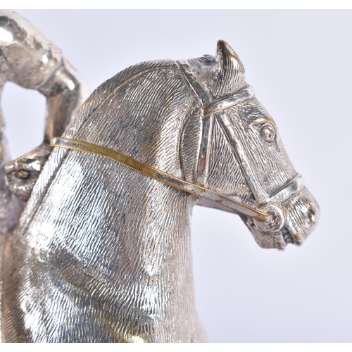 299 - AN ANTIQUE SILVER PLATED AND PINE POLO PLAYER FIGURE. 794 grams. 19 cm x 10 cm.