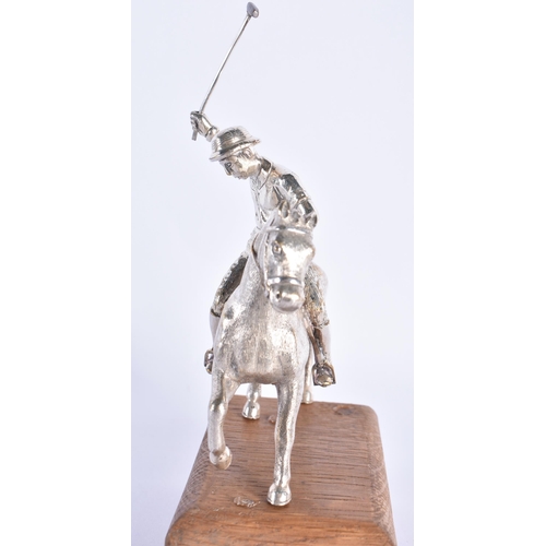 299 - AN ANTIQUE SILVER PLATED AND PINE POLO PLAYER FIGURE. 794 grams. 19 cm x 10 cm.