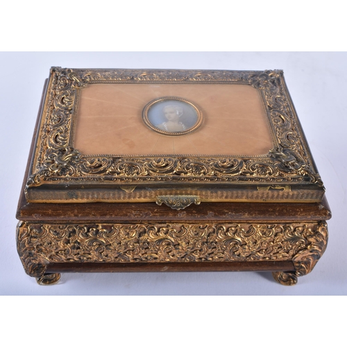 304 - A LARGE EARLY VICTORIAN MAHOGANY DOME TOP BOX together with a French gilt metal repousse casket, ins... 