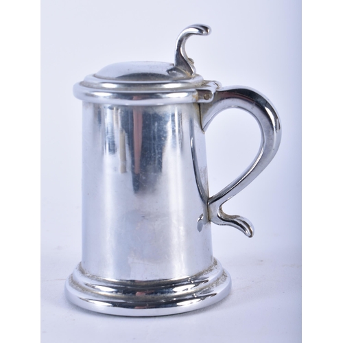 310 - A DUNHILL CHROME TANKARD TABLE LIGHTER. 9 cm x 5 cm.