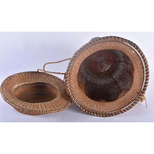 321 - AN UNUSUALLY FINE TRIBAL CARVED WICKER BASKET AND COVER together with a similar wicker sliding pouch... 