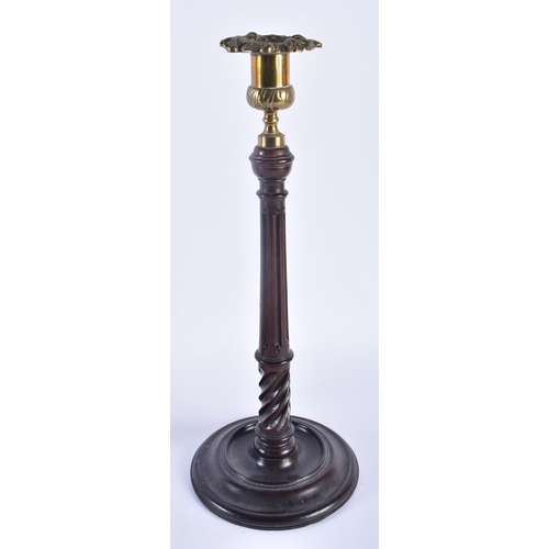 326 - A PAIR OF EDWARDIAN MAHOGANY CANDLESTICKS. 34 cm high.