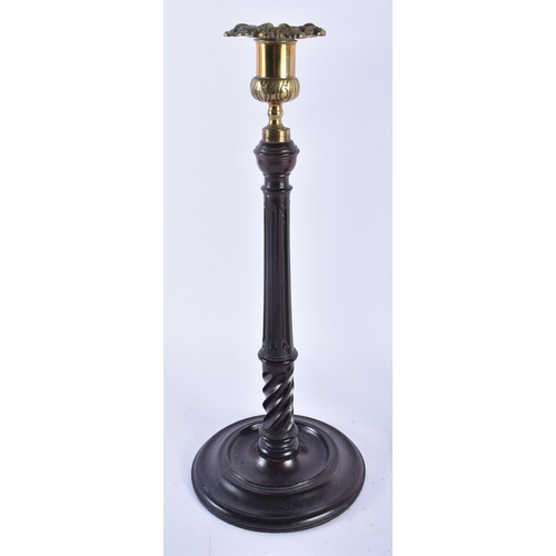 326 - A PAIR OF EDWARDIAN MAHOGANY CANDLESTICKS. 34 cm high.