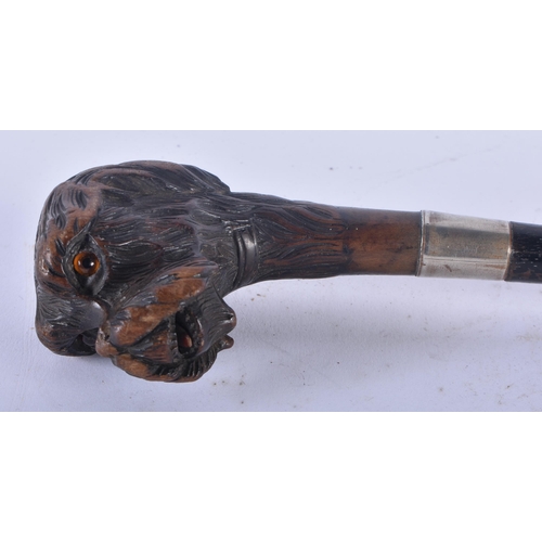 332 - AN ANTIQUE BAVARIAN BLACK FOREST CARVED DOG HEAD SWAGGER STICK. 65 cm long.