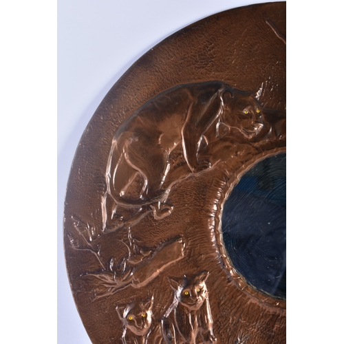 335 - A RARE ART DECO COPPER REPOUSSE COUNTRY HOUSE MIRROR depicting a pack of lions within a landscape. 5... 