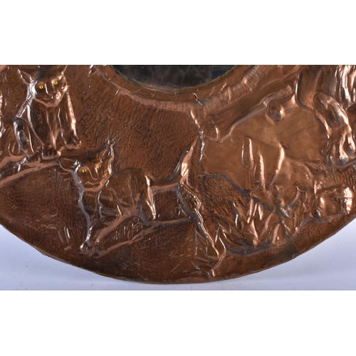 335 - A RARE ART DECO COPPER REPOUSSE COUNTRY HOUSE MIRROR depicting a pack of lions within a landscape. 5... 