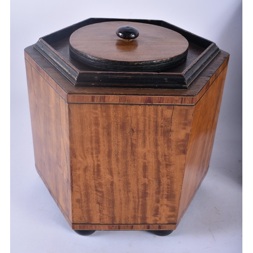 337 - A GEORGE III MAHOGANY TEA CADDY together with a large satinwood biscuit barrel and cover. Largest 20... 