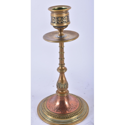 357 - A PAIR OF ARTS AND CRAFTS BRONZE AND COPPER CANDLESTICKS decorated with floral sprays and motifs. 19... 