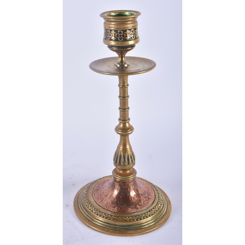 357 - A PAIR OF ARTS AND CRAFTS BRONZE AND COPPER CANDLESTICKS decorated with floral sprays and motifs. 19... 