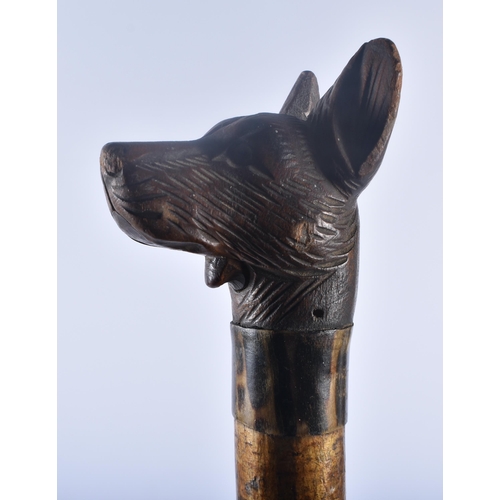 365 - A RARE 19TH CENTURY BAVARIAN BLACK FOREST CARVED WOOD DOG STAFF with articulated mouth. 140 cm long.