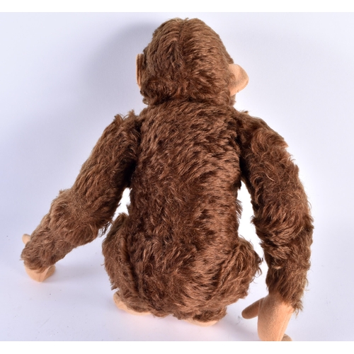 401 - A MID CENTURY POSSIBLE STEIFF MONKEY WITH SQUEAKER. 25cm high.