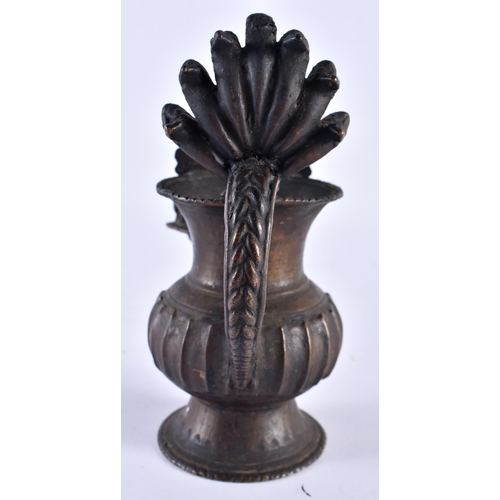 404 - A 19TH CENTURY NEPALESE INDIAN BRONZE RITUAL VESSEL formed with buddhistic figures. 18cm x 16 cm.