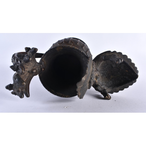 404 - A 19TH CENTURY NEPALESE INDIAN BRONZE RITUAL VESSEL formed with buddhistic figures. 18cm x 16 cm.