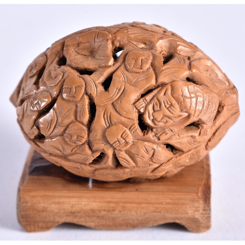 411 - A COLLECTION OF 19TH/20TH CENTURY CHINESE CARVED NUTS Late Qing, in various forms and sizes. 5 cm x ... 