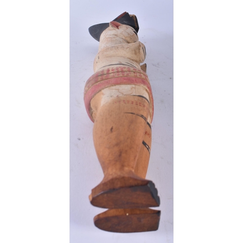 428 - AN UNUSUAL AFRICAN TRIBAL PAINTED WOOD FIGURE modelled with hands covering her breasts. 30cm high.