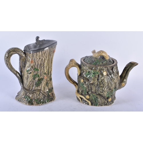 431 - A VICTORIAN MAJOLICA TEAPOT AND COVER together with a matching pewter mounted jug. Largest 20 cm x 1... 